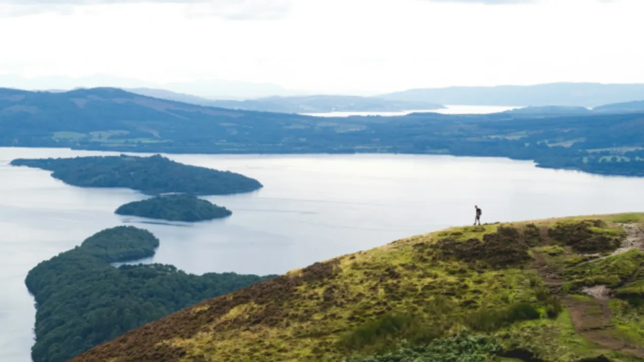 Man hiking scottish highlands